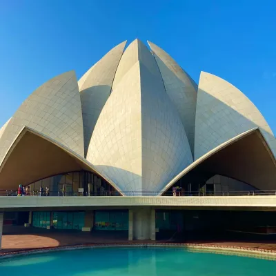 Lotus Temple: A beautiful, white lotus-shaped structure surrounded by gardens.