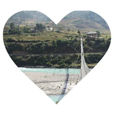 Suspension Bridge: Punakha "Swinging serenity over sacred waters."